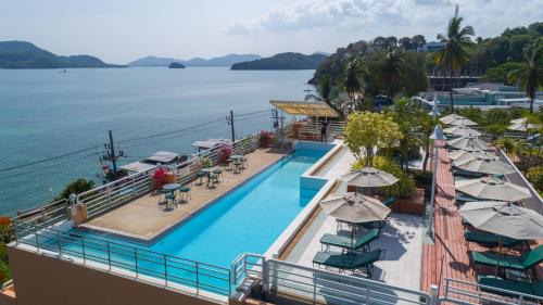 an aerial view of a resort with a swimming pool at Kantary Bay Hotel Phuket in Panwa Beach