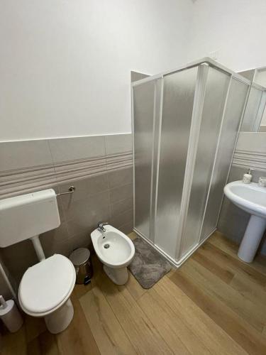 a bathroom with a shower and a toilet and a sink at Dal barone in Capo dʼOrlando