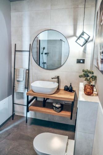 a bathroom with a sink and a mirror at Villa IVaLA in Pula