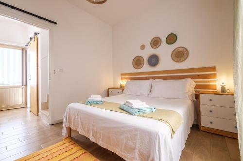 Postel nebo postele na pokoji v ubytování Mira casa
