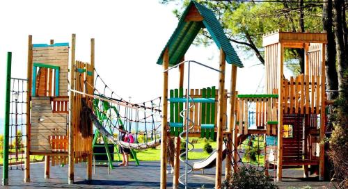 a playground with a slide in a park at Guesthouse Soso in K'obulet'i