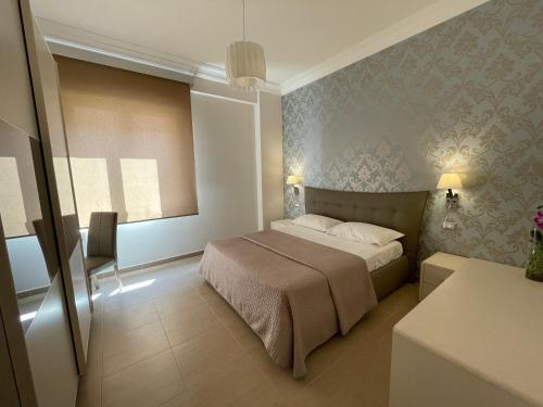 Ένα ή περισσότερα κρεβάτια σε δωμάτιο στο Xacca Luxury Apartment