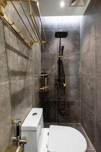 a bathroom with a toilet and a shower at JOVIAL PREMIUM DREAMHOUSE 4ROOM 8PAX@NEAR ICONCITY in Bukit Mertajam