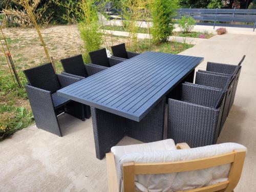 a blue picnic table with chairs at Résidence de la gare, chambre meublée in Longjumeau