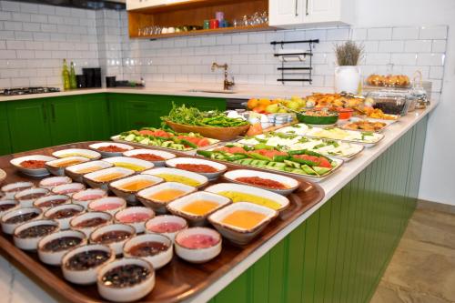 a buffet with many different types of food on it at Maslin Otel in Gokceada Town