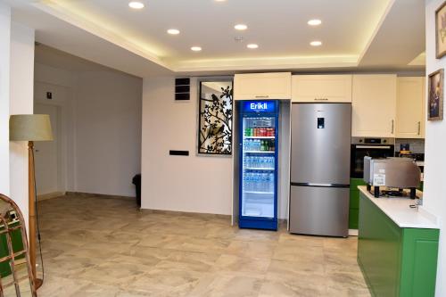 a vending machine in a room with a kitchen at Maslin Butik Otel in Gokceada Town