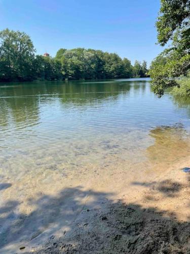 a large body of water with trees in the background at Fewo Itzehoe in Itzehoe