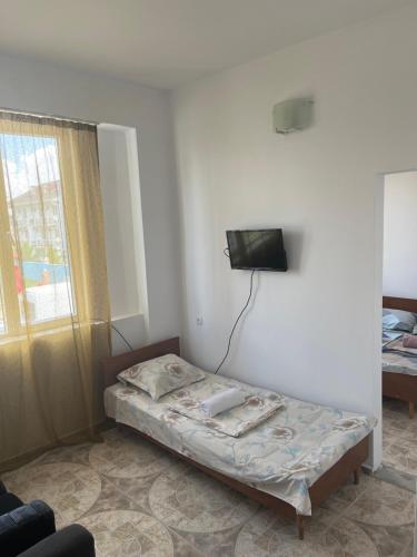 Voodi või voodid majutusasutuse Ureki Hotel Olympia Family Room toas