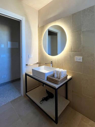 a bathroom with a sink and a mirror at La casa di Irene - Suites con vista in Ragusa