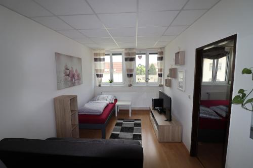 a living room with a couch and a table at Ferienwohnung GGM in Judenburg