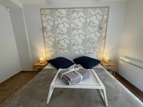 Ένα ή περισσότερα κρεβάτια σε δωμάτιο στο Appartement aux portes de Genève
