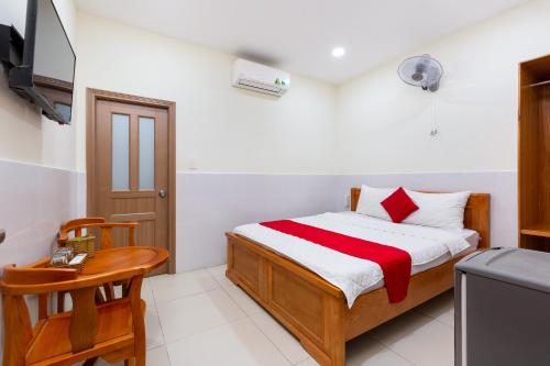 Un ou plusieurs lits dans un hébergement de l'établissement Rita Hotel near Tan Son Nhat Airport