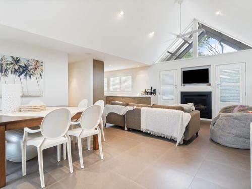 a living room with a table and chairs and a couch at Kos Place in Blairgowrie by Ready Set Stay in Blairgowrie