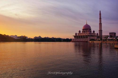 a mosque on the banks of a body of water at Putrajaya Transit Romestay in Putrajaya
