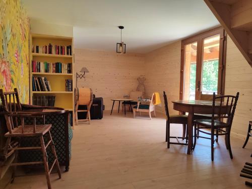 a dining room with a table and chairs at ACCOTINAE in Mont-Saxonnex