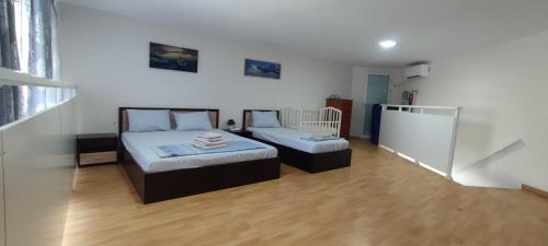 a bedroom with two beds in a room at Marianna's apartment 2 in Nea Moudania