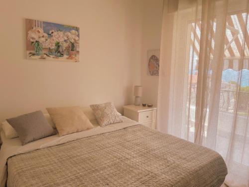 Tempat tidur dalam kamar di Appartamento Corallo Rosso e Stella Blu