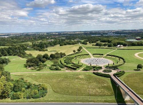 an aerial view of a park with a fountain at Campbell Park apartment with a balcony and free parking in Milton Keynes