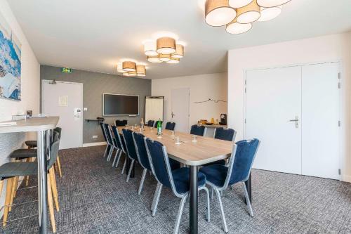 a conference room with a long table and chairs at Best Western Marseille Aeroport in Vitrolles