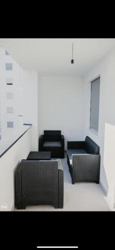 a living room with two chairs and a couch at Luxury Apartment in Lukavac