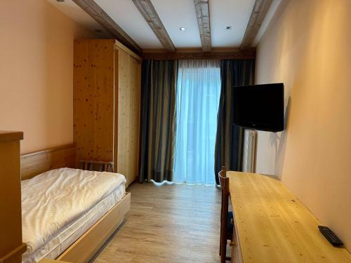 Μια τηλεόραση ή/και κέντρο ψυχαγωγίας στο Hotel Cima Rosetta - BW Signature Collection