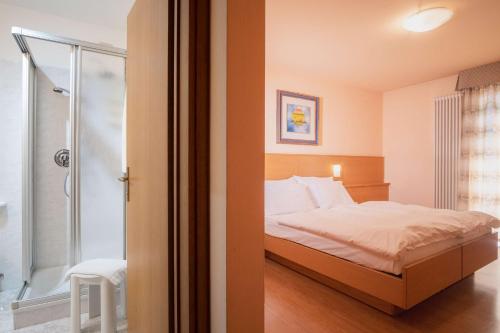 Ένα ή περισσότερα κρεβάτια σε δωμάτιο στο Hotel Cima Rosetta - BW Signature Collection