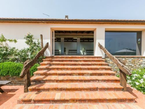 a set of stairs in front of a house at Apartment Santa Marta by Interhome in Cinigiano