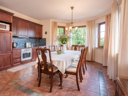 a kitchen with a table and chairs in a room at Holiday Home Sianożęty by Interhome in Sianozety