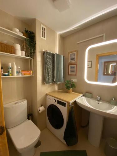 a small bathroom with a toilet and a sink at Your perfect vacation in Roquetas de Mar