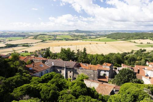 an aerial view of a village with fields and houses at Hôtel Origines par Adrien Descouls in Issoire