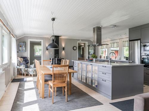 a kitchen and dining room with a table and chairs at Holiday Home Gapern - VMD044 by Interhome in Killstad