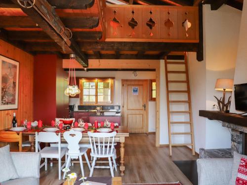 a kitchen and dining room with a table and chairs at Apartment Argentière 8 by Interhome in Villars-sur-Ollon