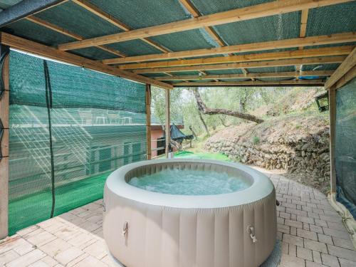 a hot tub in the middle of a patio at Holiday Home Villetta Linara by Interhome in Sestri Levante