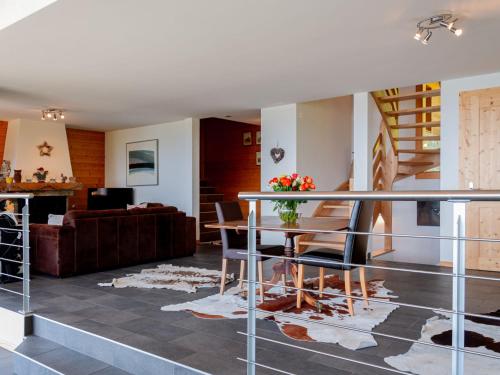 a living room with a table and a couch at Chalet Chalet Arvine by Interhome in Nendaz