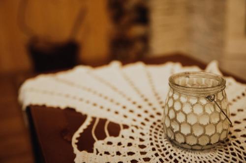 a glass jar sitting on top of a table at Jasminowe Wzgorze in Wilkanów