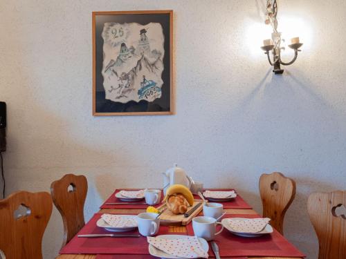 a table with a cat sitting on top of it at Apartment Ecluses 2 by Interhome in Nendaz