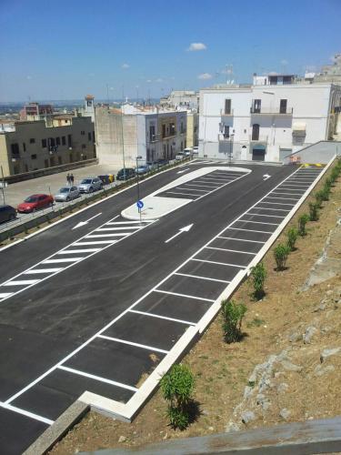 an empty parking lot in a city with buildings at DIMORA STORICA ALLA ROTONDA in Mottola