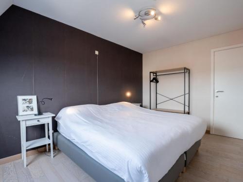 Postel nebo postele na pokoji v ubytování Apartment Duplex by Interhome