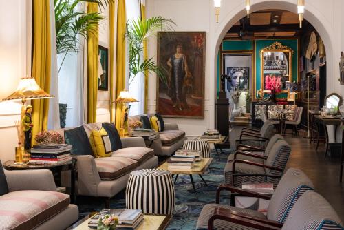 a living room with couches and chairs and tables at Hotel Vilòn - Small Luxury Hotels of the World in Rome