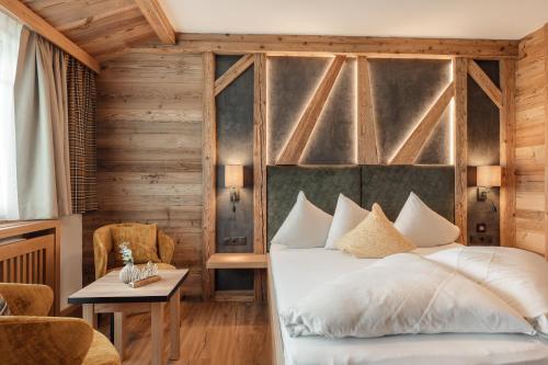 Postel nebo postele na pokoji v ubytování Kohlerhof - 4 Star Wellness & Active Hotel