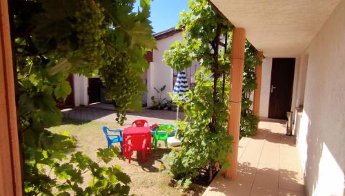 a patio with chairs and a table in a yard at Chata Lucie pod Řípem in Roudnice nad Labem