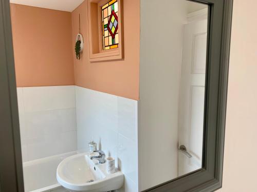 a bathroom with a sink and a shower at Stunning Rural Apartment - Sleeps 6 - Parking in Lichfield
