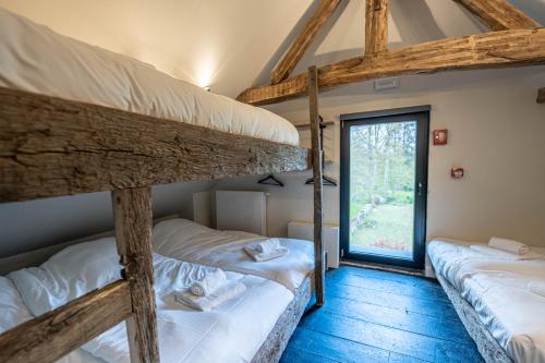 Postel nebo postele na pokoji v ubytování La Tannerie De Durbuy B&B