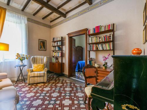 a living room with a couch and a chair at Villa Il Belvedere by Interhome in Lari