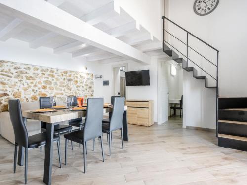 a dining room with a table and chairs at Villa Orizzonte Holidays by Interhome in Realmonte
