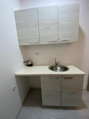 a bathroom with a sink and a mirror at Hotel FOCUS in Prilep