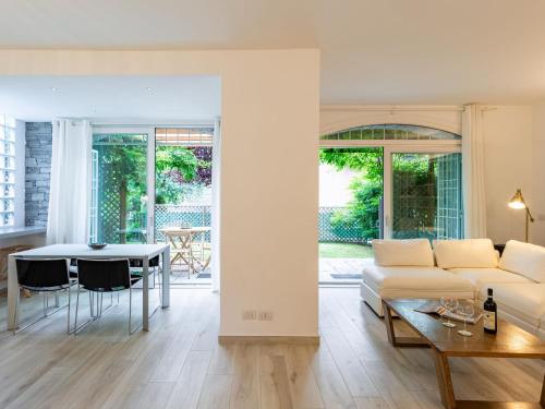 a living room with a couch and a table at Holiday Home Luxury House by Interhome in Colico