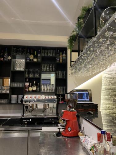 a kitchen with a counter top with a blender at Hotel FOCUS in Prilep
