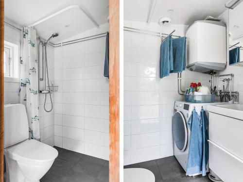 a bathroom with a toilet sink and a washing machine at Chalet Jennys by Interhome in JÃ¤mjÃ¶