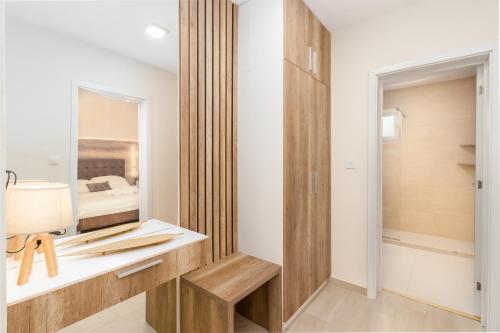 a bathroom with a sink and a mirror at Apartments Ada Bojana in Ulcinj